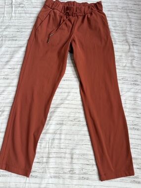 Lululemon On the Fly 7/8 Pants Rust Orange Drawstring